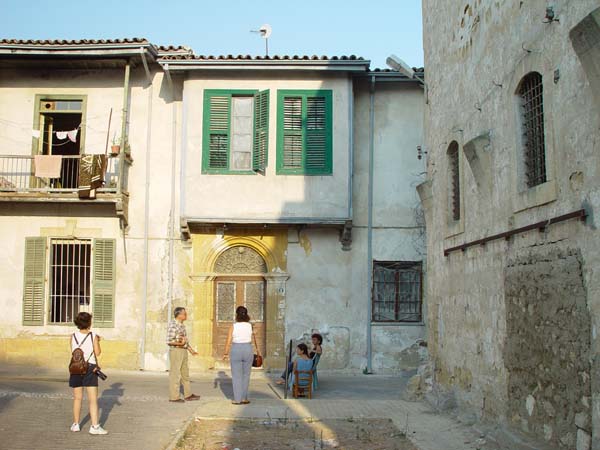 Ani and the'new owners' of their house (seated)