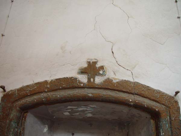 Cross above door